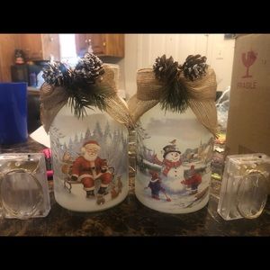 Glass frosted Christmas jars with beautiful Christmas time scenes and lights.